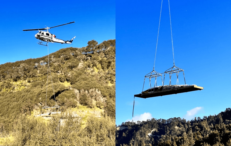 Two side by side photos, the first of a helicopter with a waka secured underneath, the second a close-up of the waka hanging from ropes