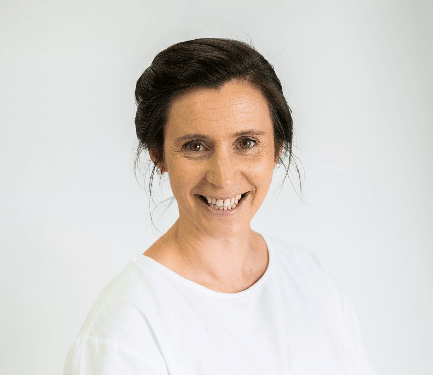 a white woman wearng a white shirt on a white background