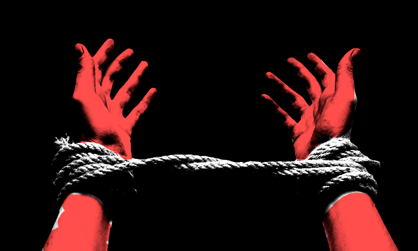 hands tied by a rope red looks dangerous and scary