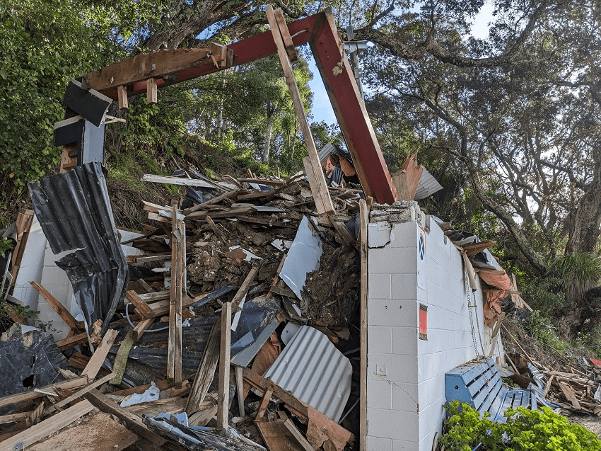 a pile of rubble with some trees above it