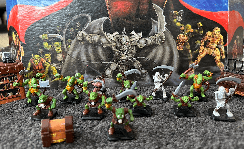 Figurines lined up from the board game Hero Quest.