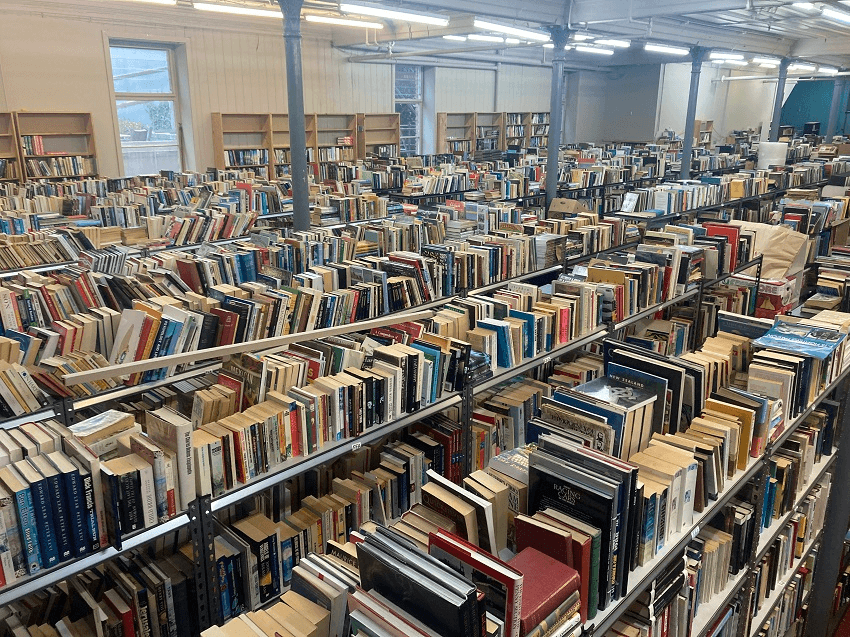 a very cluttered warehouse of books! 