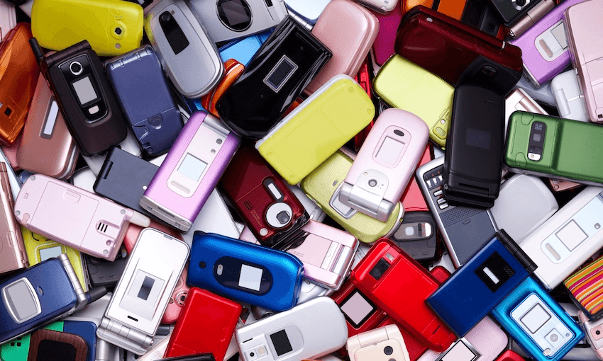 a pile of old phones lying on the ground