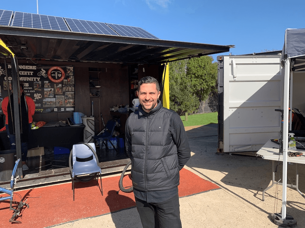 Sims standing outside the Māngere bike hub.