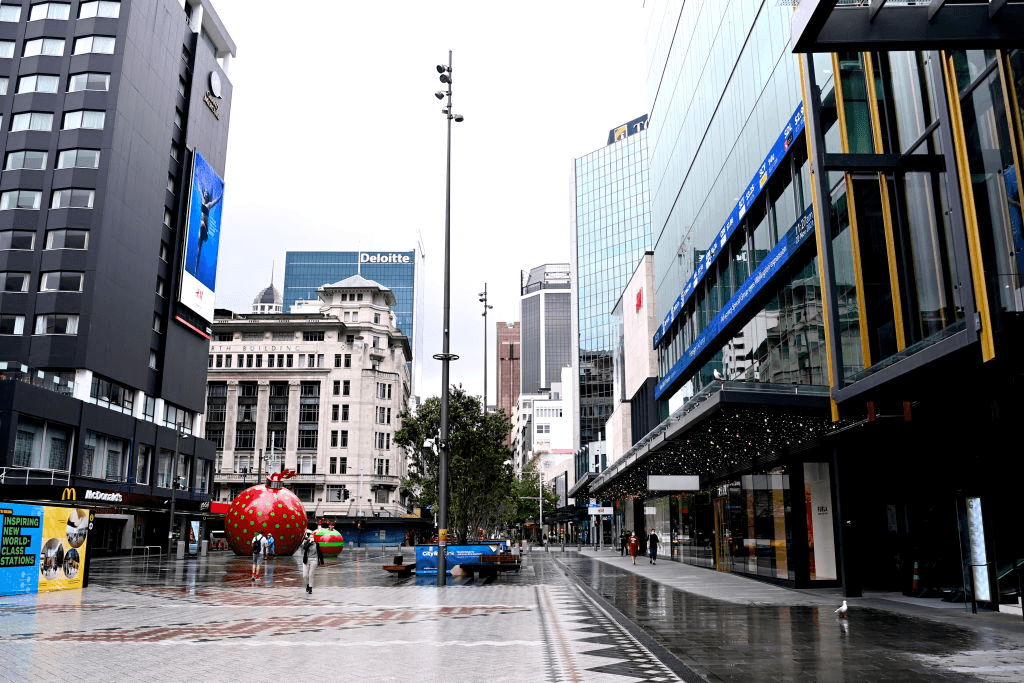 AUCKLAND, NEW ZEALAND – NOVEMBER 22: Members of the public walk through Te Komititanga square on November 22, 2021 in Auckland, New Zealand. Auckland has become this first District Health Board in New Zealand to reach 90 per cent of the eligible population to receive two doses of a COVID-19 vaccine. (Photo by Hannah Peters/Getty …  Read more 
