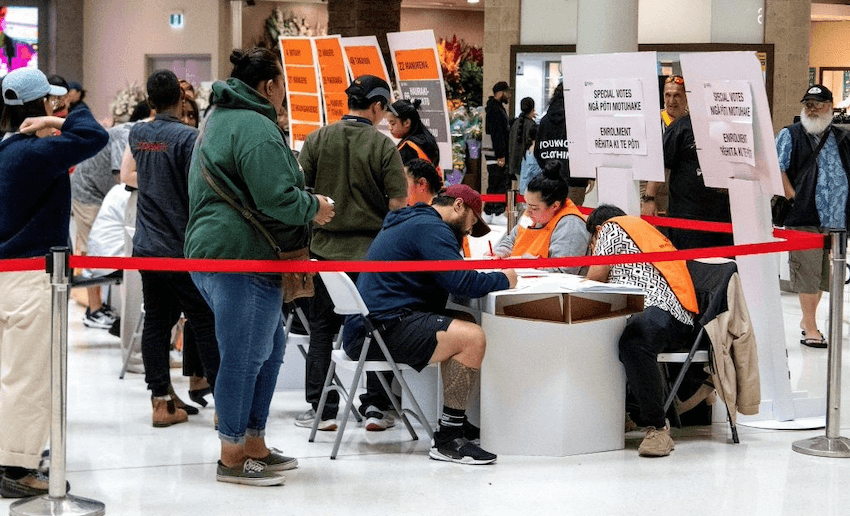 Voters wait in queues to cast their votes in the 2023 NZ general election. (Photo: IVAN TARLTON/AFP via Getty Images)