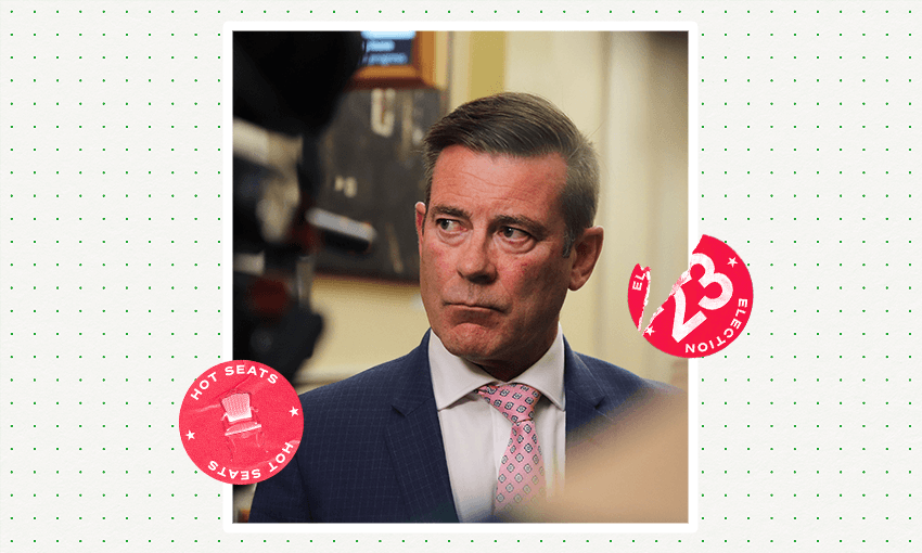 a middle aged white man in a suit and tie looking serious