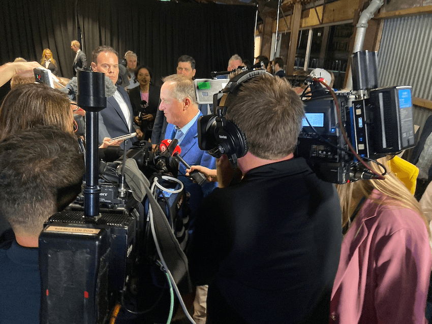 John Key surrounded by media (Photo: Stewart Sowman-Lund) 
