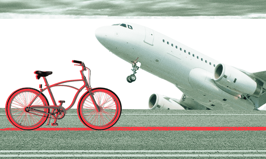 a bike on a red line against a green/grey turned aeroplane looking menancing