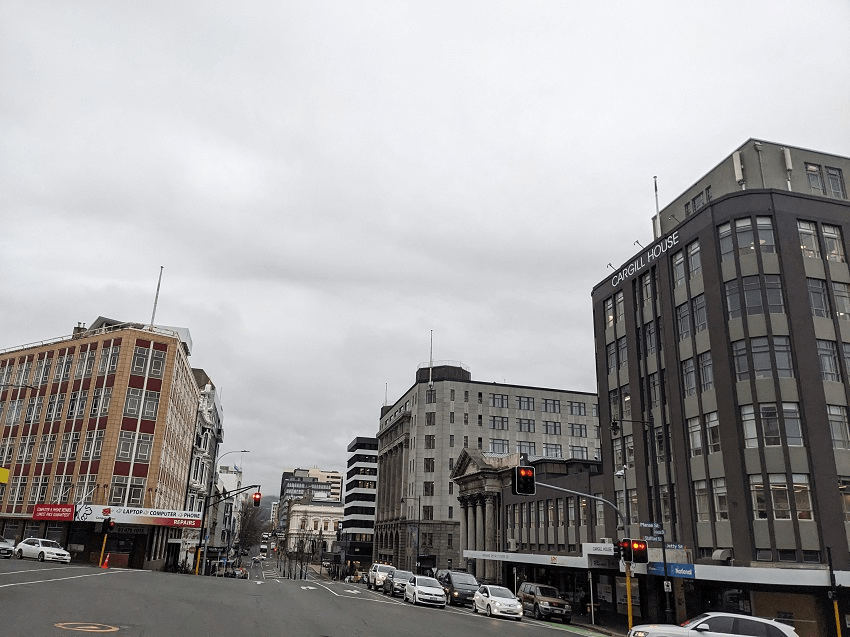 a greyish city street with buildings of approximately five stories in central dunedin - this is Prince's Street