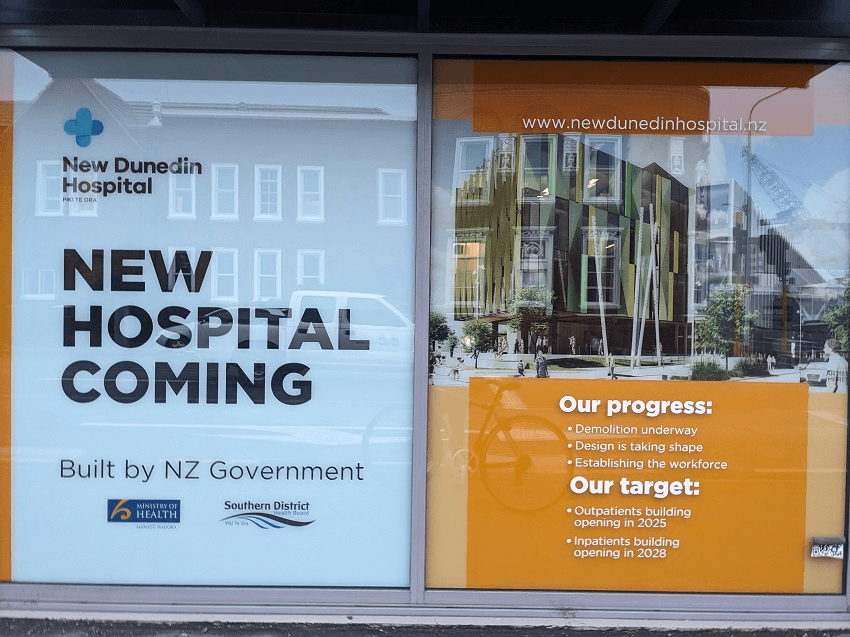 a sign saing "new hospital coming'