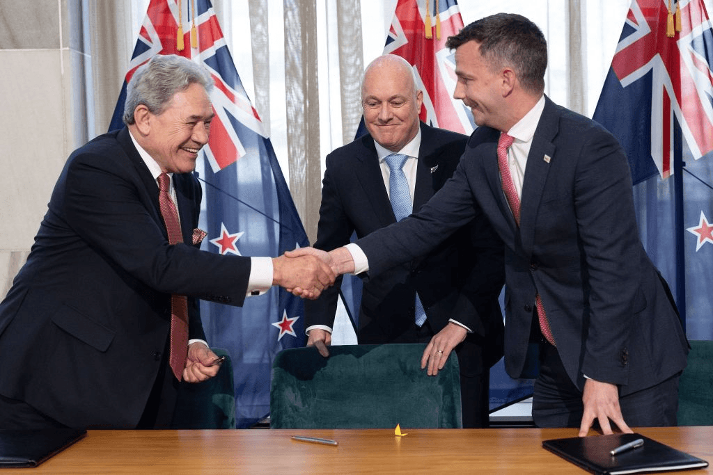 The handshake after the coalition agreements were signed, November 24, 2023. (Photo by Marty MELVILLE / AFP). 
