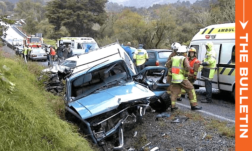 Emergency service personnel attend a serious car crash south of the Brynderwyn Range, Northland, in 2004. (Photo: teara.govt.nz) 
