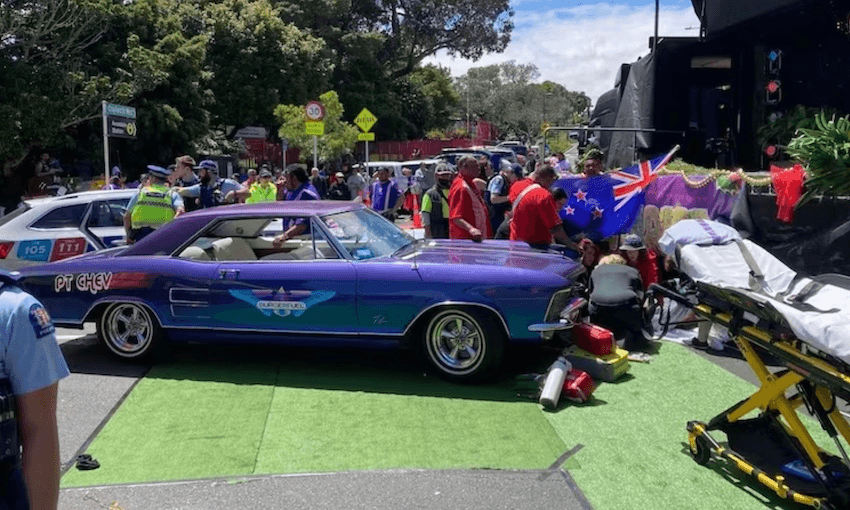 Injured pedestrians are seen to by ambulance staff at Avondale santa parade 
