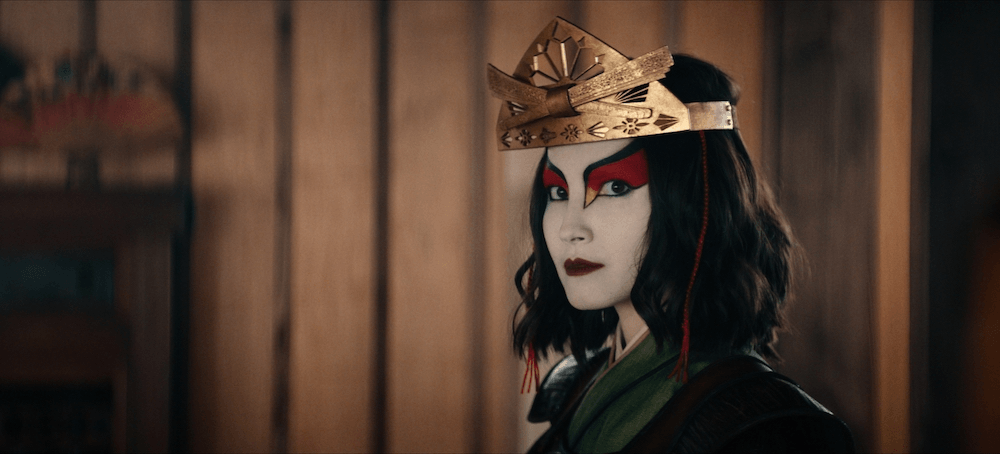 Suki, played by Maria Zhang, seen here in her war makeup, kimono and headress.