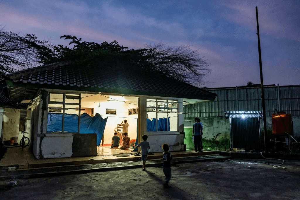 a purple twilight sky with a light inside