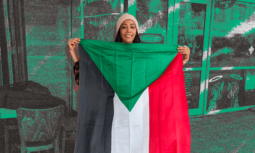 a woman holding the sudanese flag and smiling