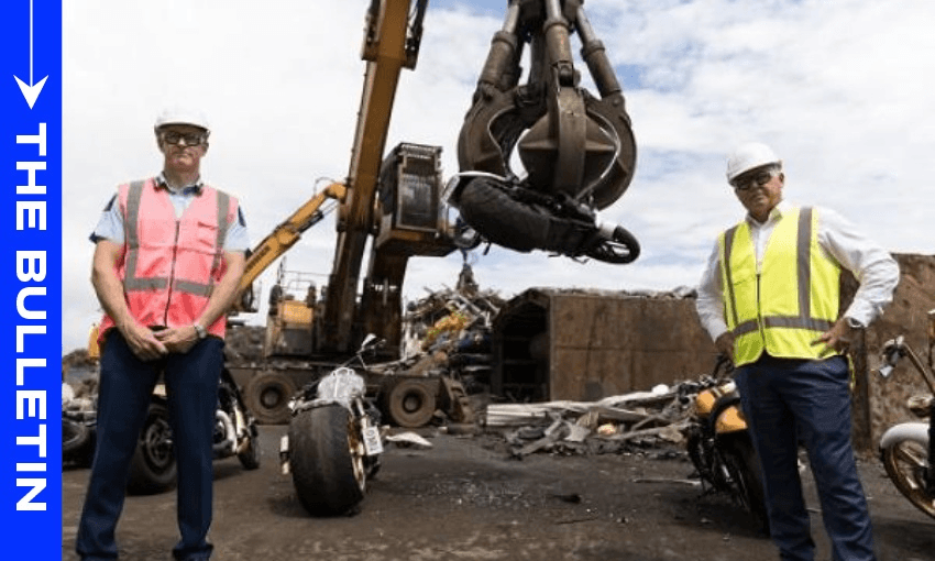 Police Commissioner Andrew Coster and police minister Mark Mitchell pose as gang bikes destroyed (Image: supplied)