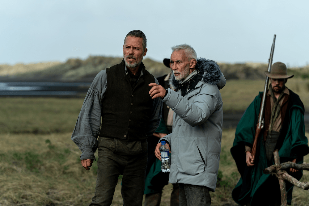 Lead actor Guy Pearce, dressed in 1830s flowy regalia, and director Lee Tamahori on set.