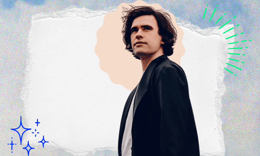 a man with brown hair and blue jacket gazing into the distance