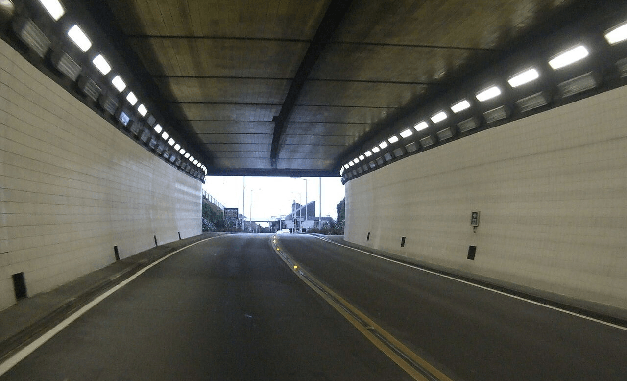 PHoto of the inside of the Lyttleton road tunnel. The sidewalls are covered in white tiles