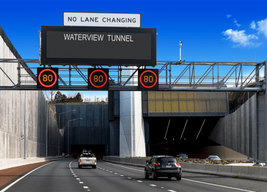 Photo of the entrance of Waterview Tunnel, with a sign saying "no lane changing".