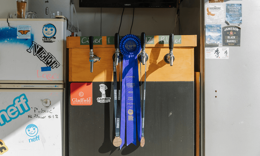 A blue show ribbon that Craig Herron won in a home brewing competition.
