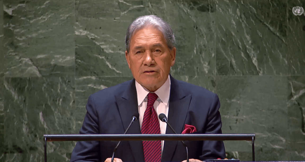 Winston Peters at a podium, with the UN logo in the top right corner.