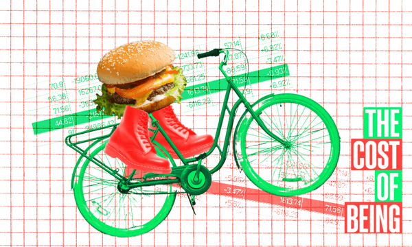 a green bicycle with bright red boots as pedals and a large hamburger positioned where the rider would sit. The background consists of a red graph paper with various green and red financial figures and charts overlaid. In the bottom right corner, there is a text in bold green and red letters reading 'THE COST OF BEING.'"