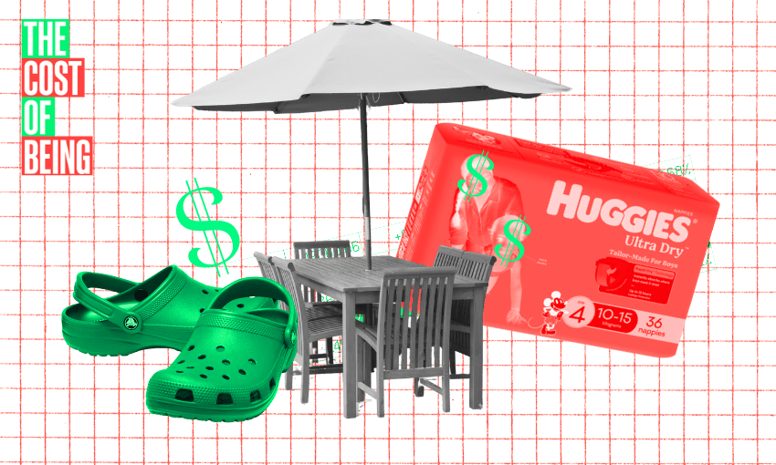 The image is a collage with a red grid background. In the foreground, there are several items with dollar signs on them, indicating their cost. These items include: A pair of green Crocs shoes. A box of Huggies Ultra Dry nappies. A grey outdoor dining set with a table, chairs, and an umbrella. The text "THE COST OF BEING" is in the top left corner