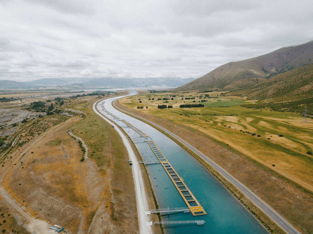 blue canals with the mountains in the background