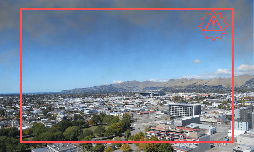 a picture of christchurch on a sunny day with grey clouds hanging over the city, a red rectangle with a little red exclamation mark in the corner