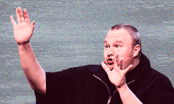 Kim dotcom, a white man with short hair and his arms out and lips pursed, with a faded static-y background