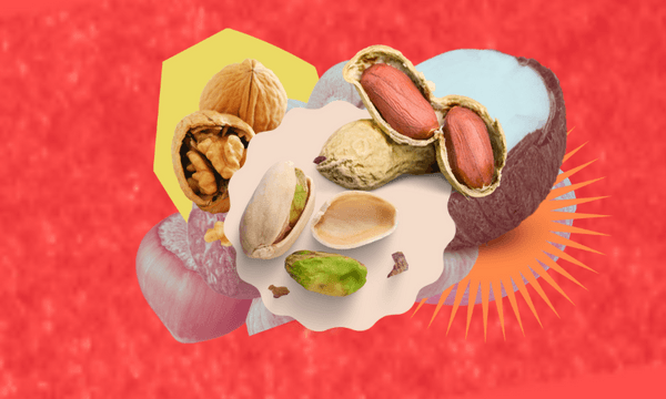 a textured red background with nuts layered on top of nuts and coconuts, walnuts, and pistachios visible