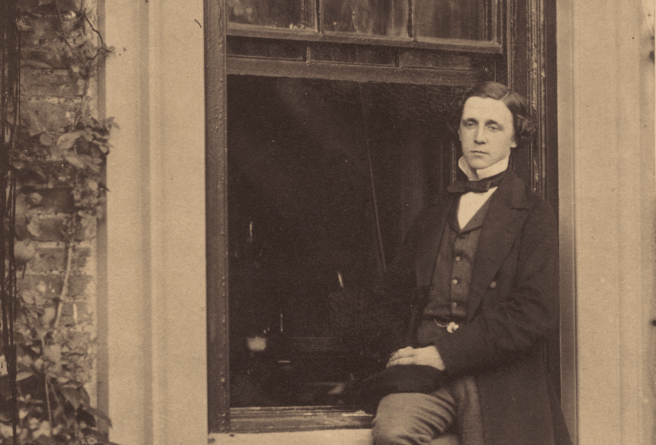 Lewis Carroll seated on a windowsill