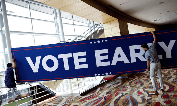 Campaign staff move a sign before a Donald Trump rally in Georgia this week. (Photo: Kevin Dietsch/Getty Images)  
