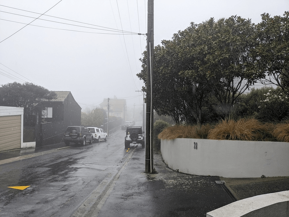 a rainy street looking very cold and grey