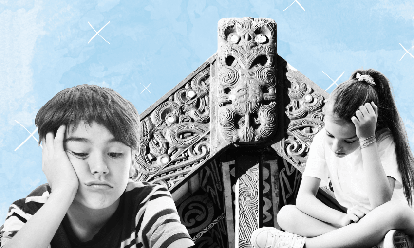 A boy and a girl sit with their heads resting on their hands, looking thoughtful. They are positioned in front of a large, intricately carved whare under a blue sky.