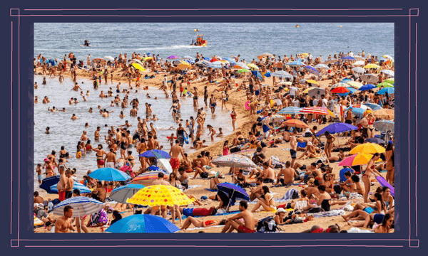 Like other New Zealanders in London, my travel aspirations are in tightening tension with their impacts on climate change, communities, and cultures. (Photo: crowds of tourist on Barceloneta beach, Barcelona, via Getty) 
