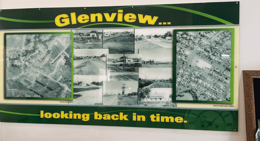 A display board labeled "Glenview... looking back in time" contains several black and white historical photographs. The images depict various scenes of the town, including aerial views and street scenes, showcasing its past.