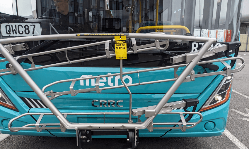 a teal metro bus with a bike rack that says 'out of order on it"