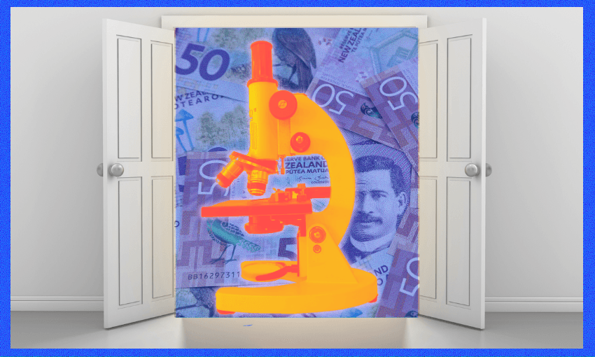 a pair of white couble doors flung open to reveal an orange microscope and lots of New Zealand 50 dollar notes