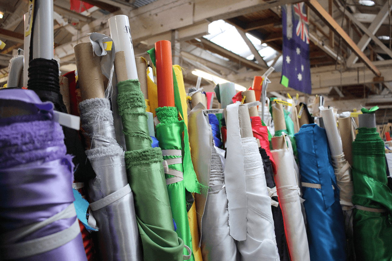 rolls of fabric in many colours