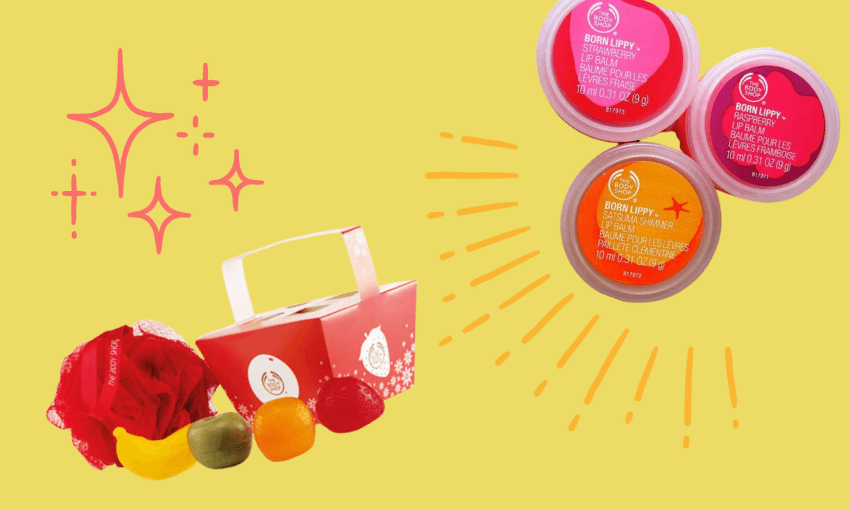 Colorful display of three "Born Lippy" lip balms in small tubs against a yellow background. Beside them, assorted fruits like kiwi, lemon, and watermelon are arranged near a red gift box with a handle, highlighted by sparkles and lines.