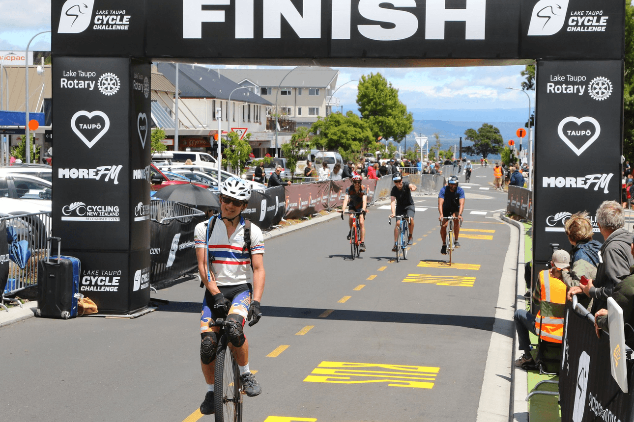 Ken Looi crossing the finish line at the Lake Tapou Cycle Challenge in 20204. 