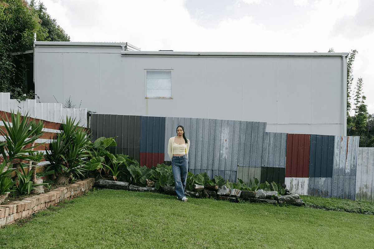 Symone Tafuna’i stands in a garden