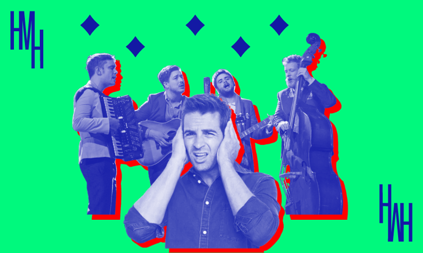 A man with his hands over his ears, with Mumford and Sons in the background