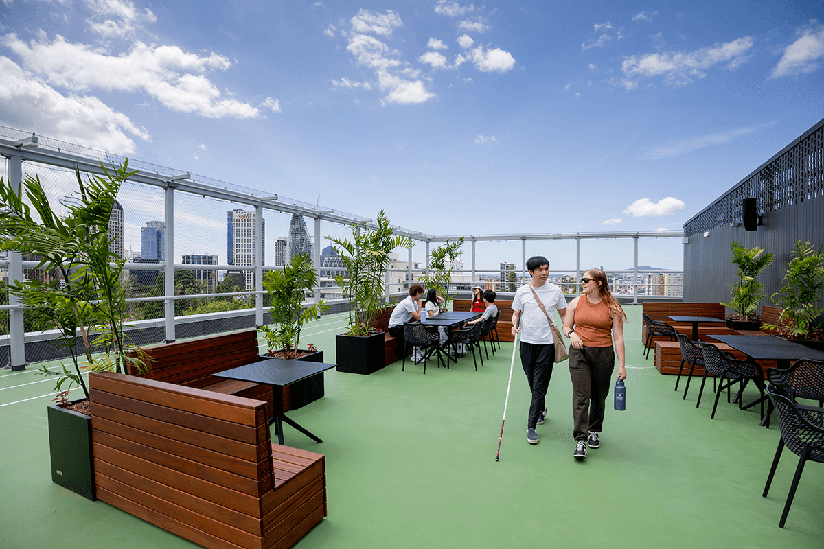 roof top in central auckland with view, and people walking around