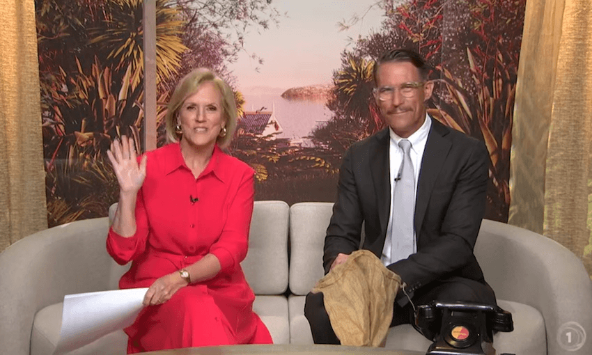 Hilary Barry and Jeremy Wells sit on a couch in the seven sharp studio, looking directly at the camera