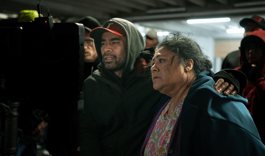 Director Miki Magasiva has his arm around Anapela Polataivao as they watch the quake scene on the monitor